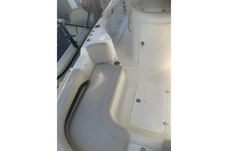 Slide: The Image of 2024 Hurricane CC231 boat interior with seating and storage compartments. - 8