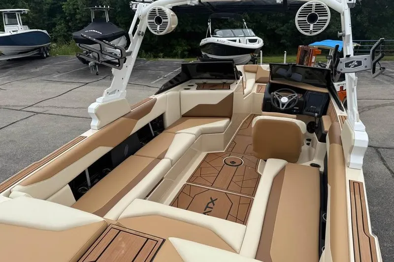 Slide: The Image of 2024 ATX Surf Boats 24 Type-S interior with tan seating and modern design. - 10