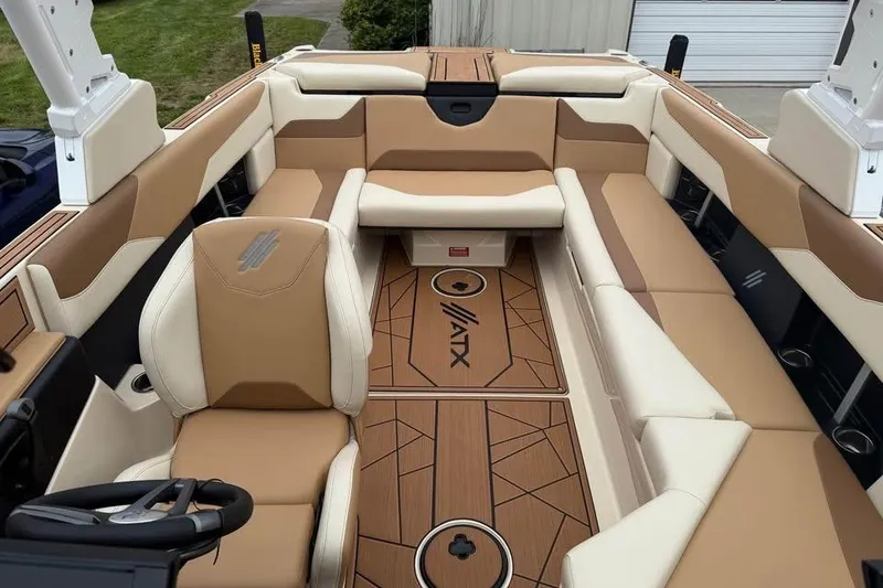 Slide: The Image of 2024 ATX Surf Boats 24 Type-S interior with tan and cream seating, stylish design. - 15
