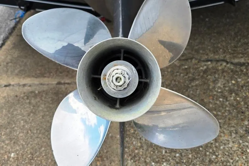 Slide: The Image of Close-up of a boat propeller from a 2008 Glastron GT205 BR on concrete surface. - 11