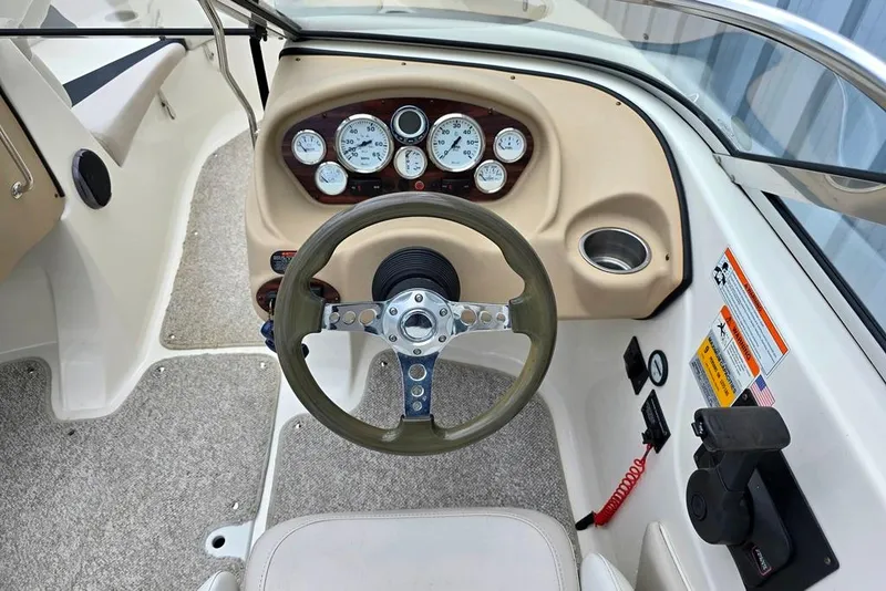 Slide: The Image of 2008 Glastron GT205 BR boat dashboard with steering wheel and instrument panel. - 13