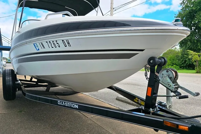 Slide: The Image of 2008 Glastron GT205 BR boat on trailer, parked outdoors. - 7