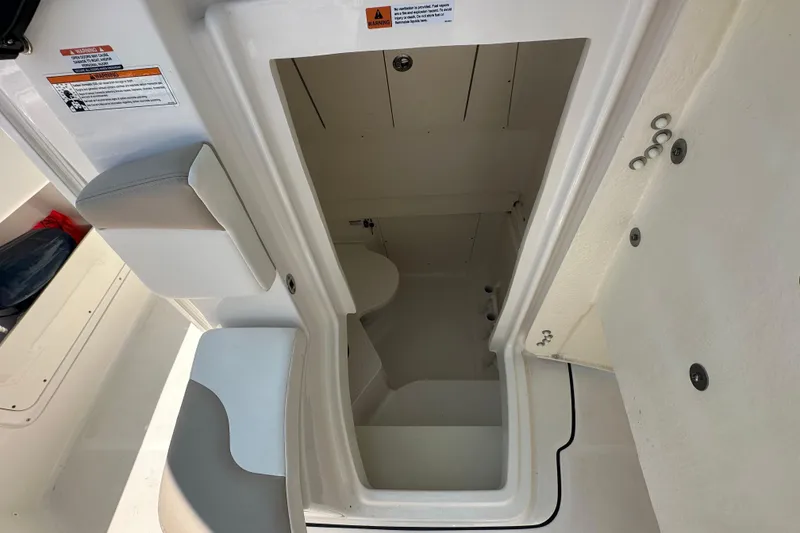 Slide: The Image of 2023 Robalo R302 Center Console boat interior storage compartment. - 20