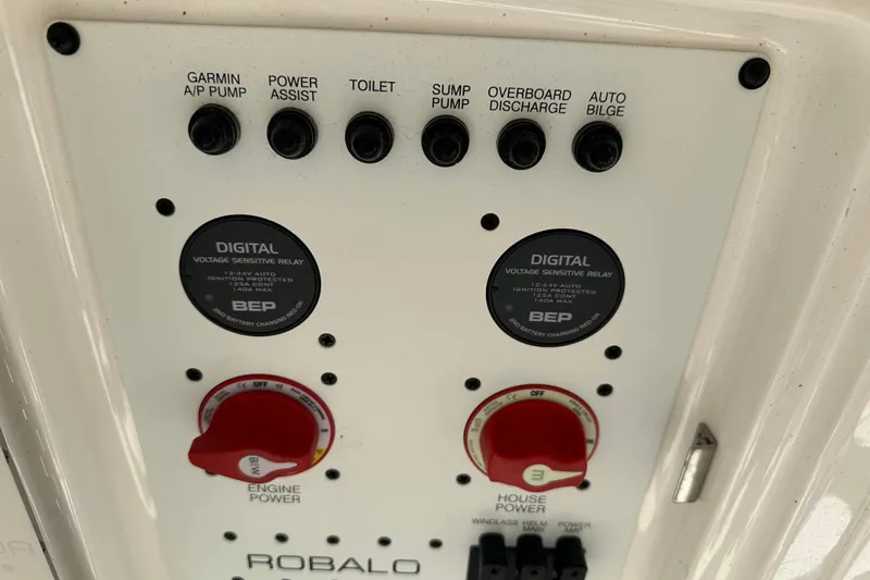 Slide: The Image of Control panel of 2023 Robalo R302 Center Console boat with digital relays and switches. - 42