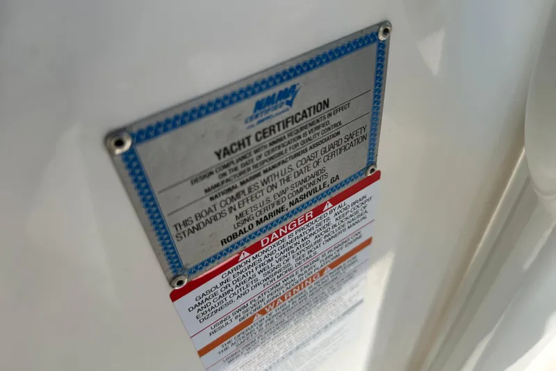 Slide: The Image of 2023 Robalo R302 Center Console yacht certification and safety warning labels. - 44