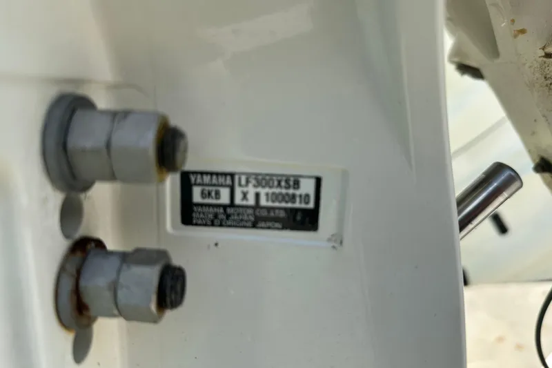 Slide: The Image of Close-up of Yamaha engine label on 2023 Robalo R302 Center Console boat. - 46