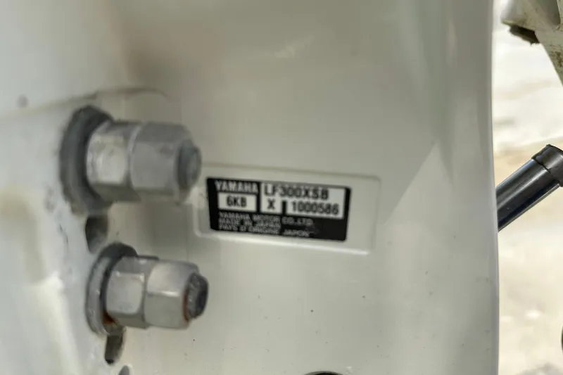 Slide: The Image of Close-up of Yamaha engine label on 2023 Robalo R302 Center Console boat. - 48