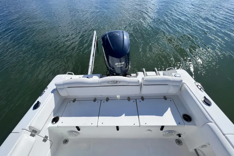 Slide: The Image of 2017 Sea Hunt Ultra 235 SE boat with Yamaha 250 engine on calm water. - 14