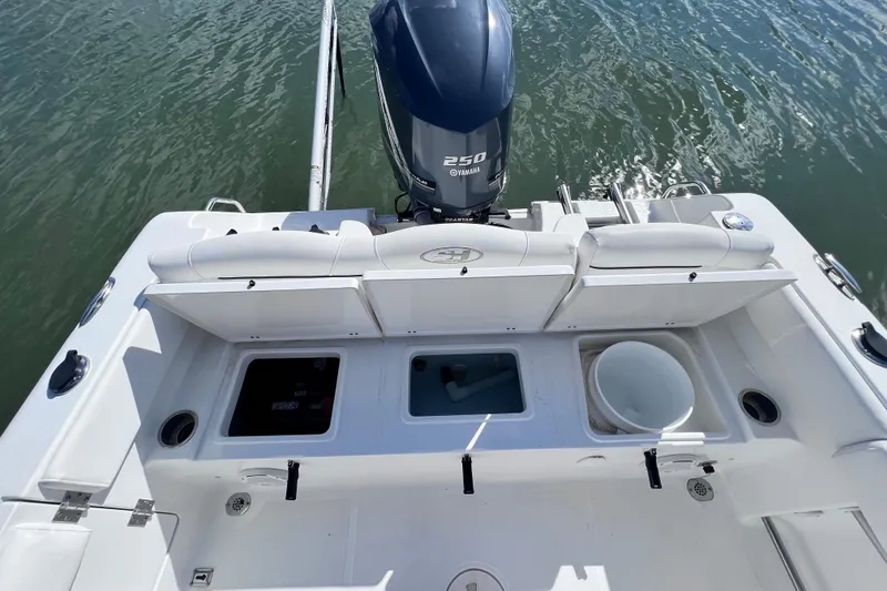 Slide: The Image of 2017 Sea Hunt Ultra 235 SE boat with Yamaha 250 engine, featuring spacious deck layout. - 15