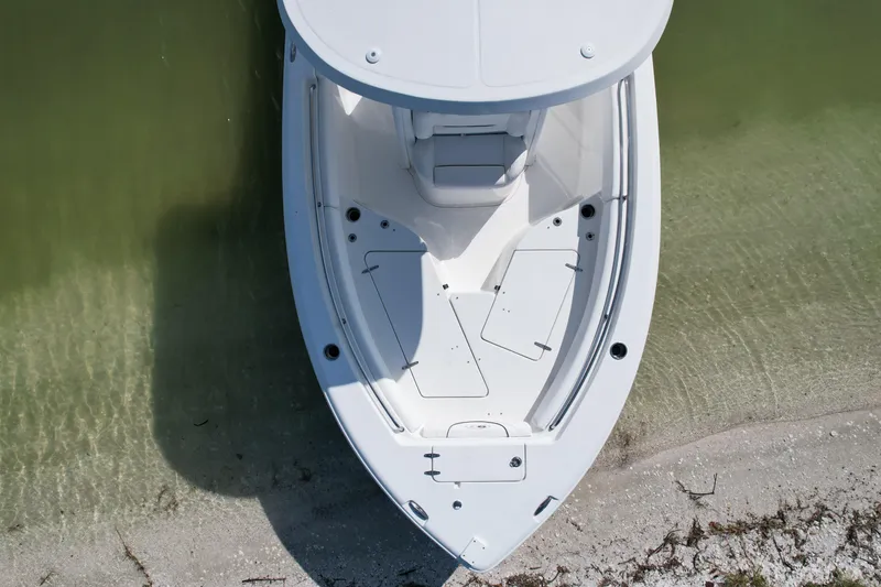 Slide: The Image of Top view of 2017 Sea Hunt Ultra 235 SE boat on clear water near sandy shore. - 4