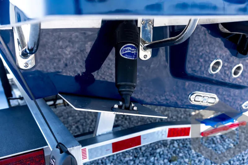 Slide: The Image of 2026 Pathfinder 2200 TRS boat with Bennet trim tab on trailer. - 29