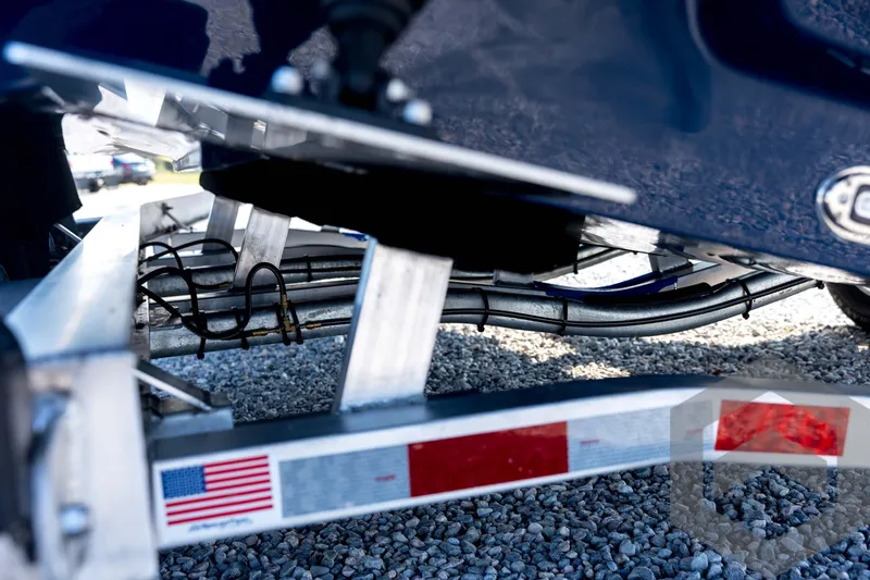 Slide: The Image of 2026 Pathfinder 2200 TRS boat trailer detail with American flag sticker. - 31