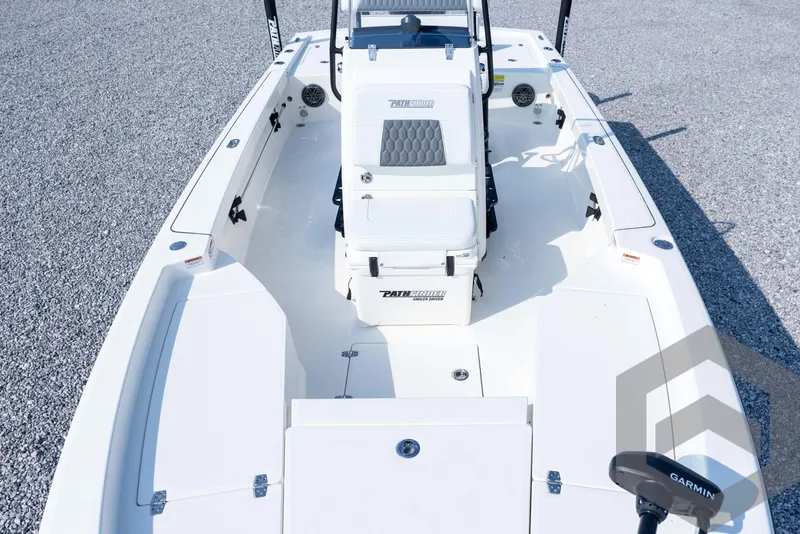 Slide: The Image of 2026 Pathfinder 2200 TRS boat interior with seating and Garmin equipment. - 35