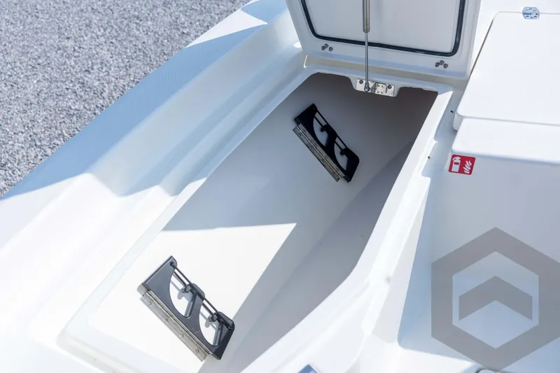 Slide: The Image of Open storage compartment on 2026 Pathfinder 2200 TRS boat, featuring secure latches and spacious interior. - 40