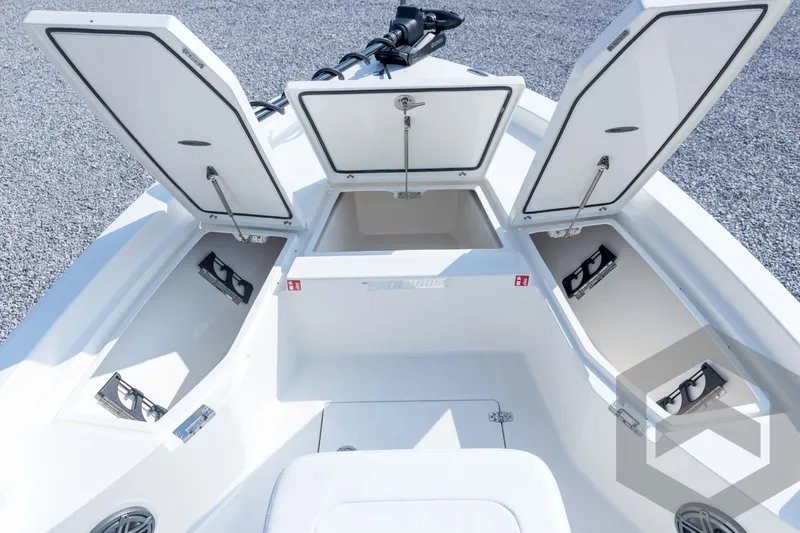 Slide: The Image of 2026 Pathfinder 2200 TRS boat with open storage compartments on deck. - 43