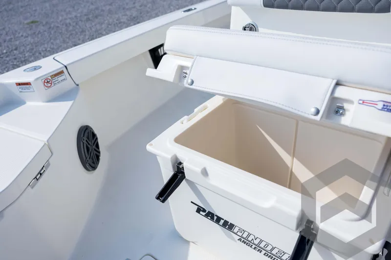 Slide: The Image of 2026 Pathfinder 2200 TRS boat interior with storage compartment open, showcasing sleek design. - 47