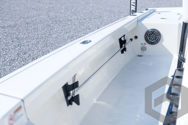 Slide: The Image of 2026 Pathfinder 2200 TRS boat interior with speaker and rod holder. - 49