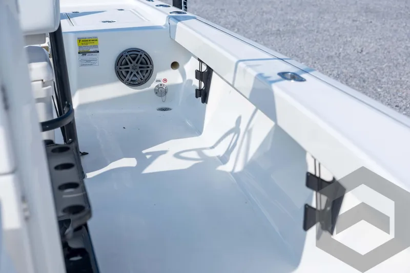 Slide: The Image of 2026 Pathfinder 2200 TRS boat interior with speaker and rod holders. - 50