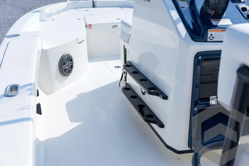 Slide: The Image of 2026 Pathfinder 2200 TRS boat interior with rod holders and speaker. - 54