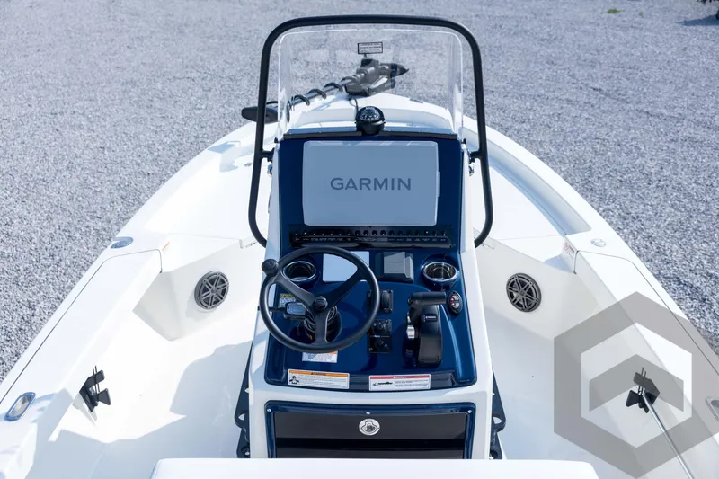 Slide: The Image of 2026 Pathfinder 2200 TRS boat console with Garmin navigation system and steering wheel. - 55