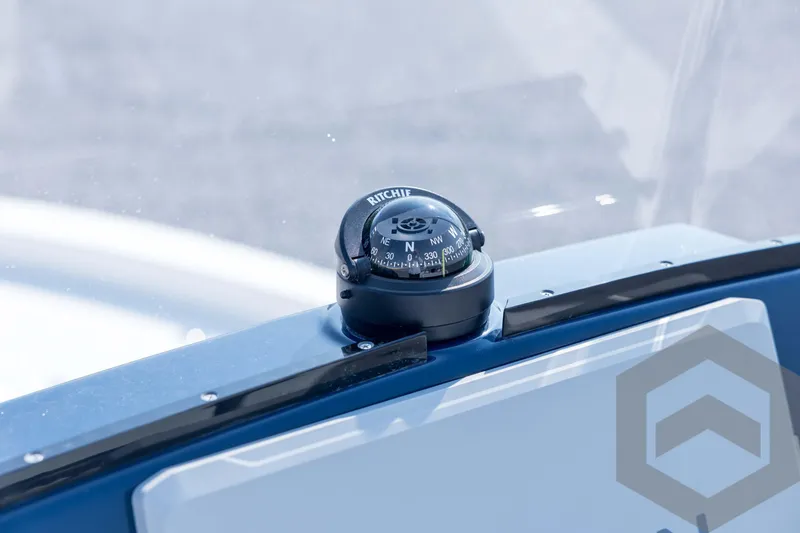 Slide: The Image of Compass on 2026 Pathfinder 2200 TRS boat dashboard, close-up view. - 56