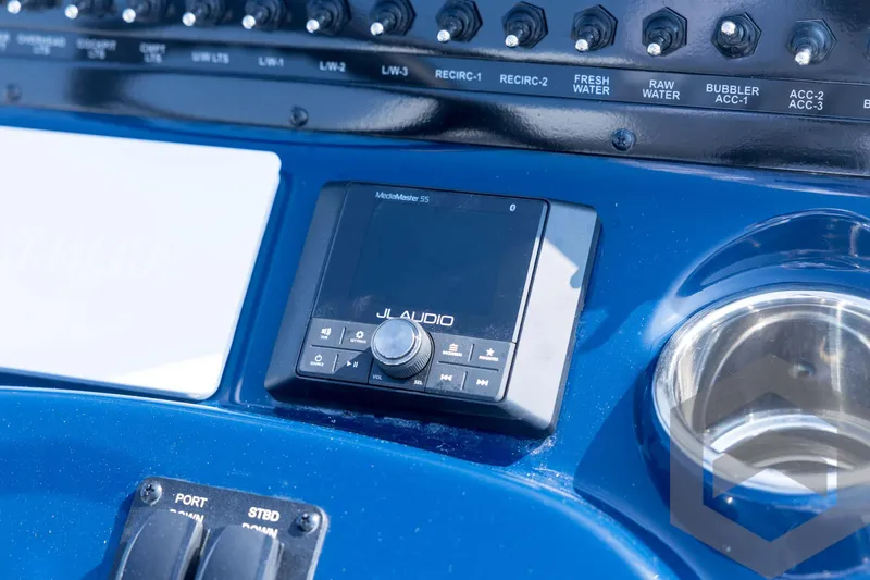 Slide: The Image of Control panel of 2026 Pathfinder 2200 TRS with JL Audio system and switches. - 58