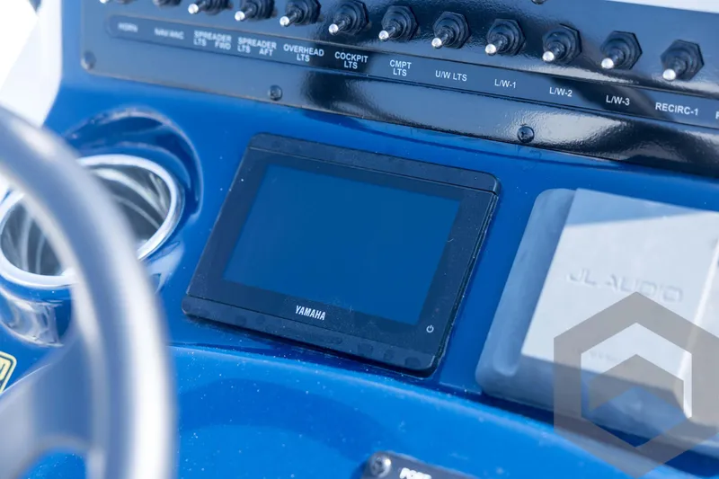 Slide: The Image of Control panel of 2026 Pathfinder 2200 TRS boat with Yamaha display and JL Audio system. - 59
