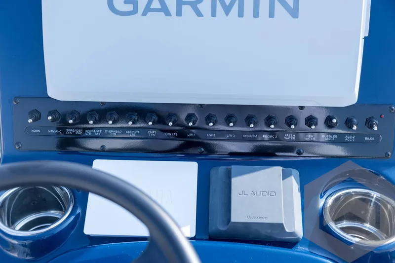 Slide: The Image of Control panel of 2026 Pathfinder 2200 TRS boat with Garmin and JL Audio systems. - 60