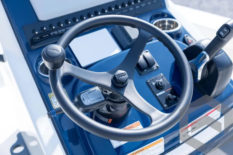 Slide: The Image of Steering console of 2026 Pathfinder 2200 TRS boat with controls and gauges. - 61