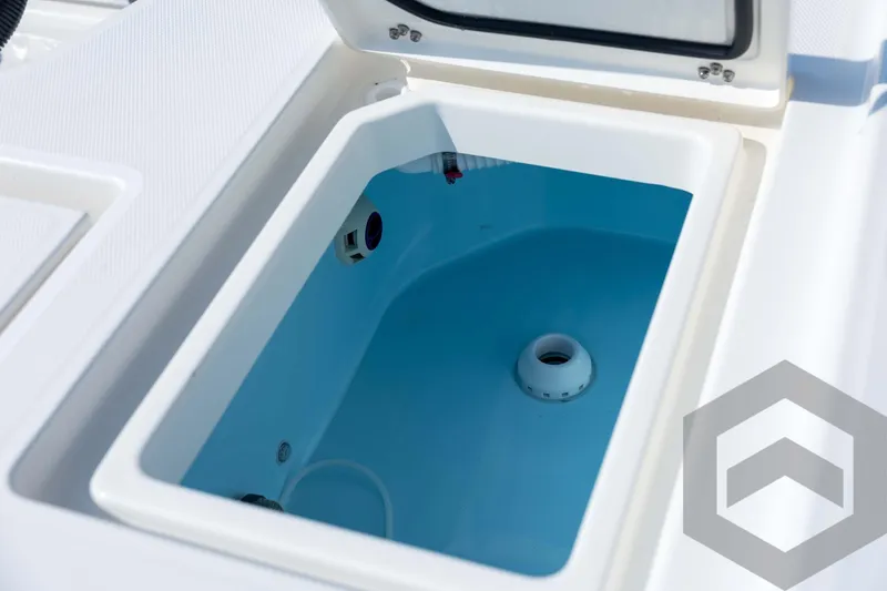 Slide: The Image of Open storage compartment on 2026 Pathfinder 2200 TRS boat, featuring a clean, white interior. - 73