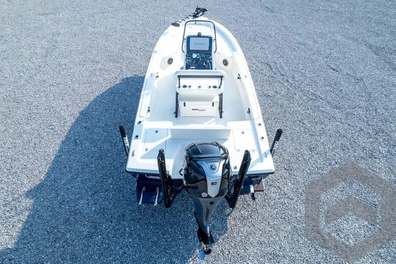 Slide: The Image of 2026 Pathfinder 2200 TRS boat with outboard motor on gravel surface. - 78