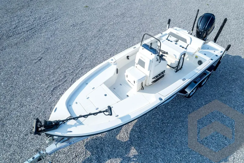 Slide: The Image of 2026 Pathfinder 2200 TRS boat on trailer, aerial view, parked on gravel. - 81