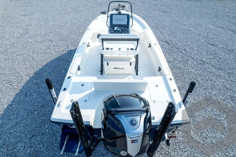 Slide: The Image of 2026 Pathfinder 2200 TRS boat with Yamaha engine, viewed from above on gravel surface. - 86