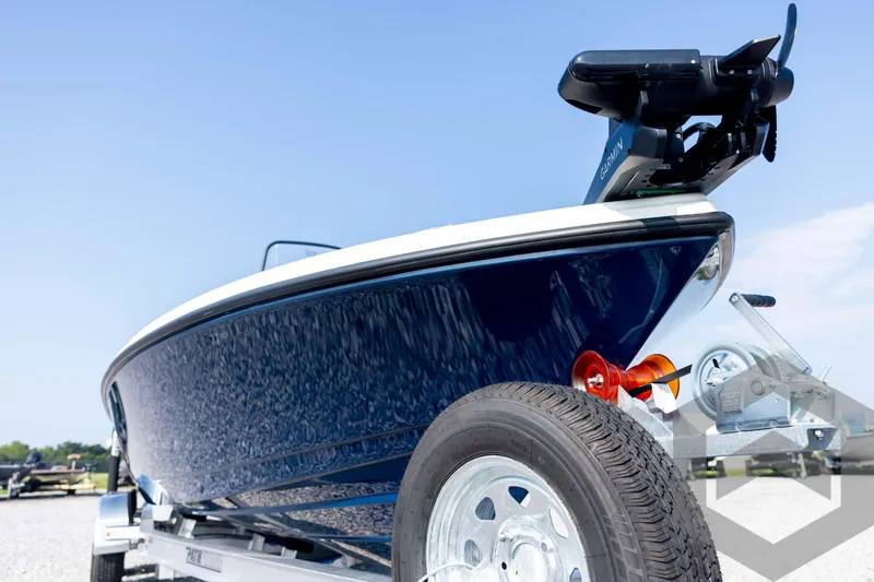 Slide: The Image of 2026 Pathfinder 2200 TRS boat on trailer, close-up view, clear sky background. - 9