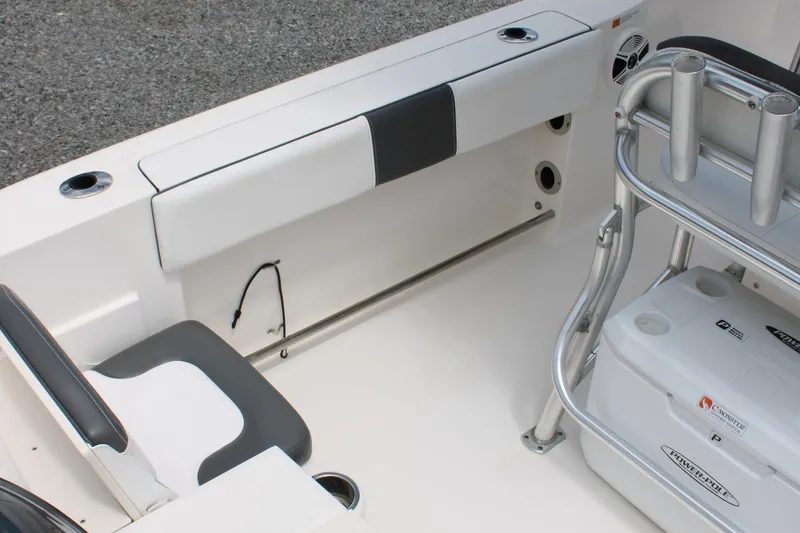 Slide: The Image of 2018 Robalo R200 Center Console boat interior with seating and storage features. - 18