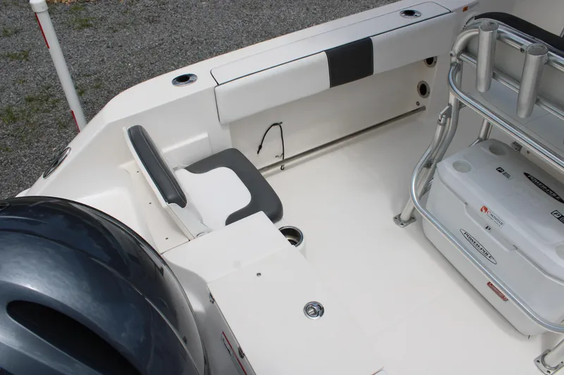 Slide: The Image of 2018 Robalo R200 Center Console boat interior with seating and storage features. - 22