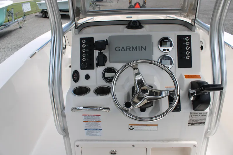 Slide: The Image of 2018 Robalo R200 Center Console dashboard with Garmin navigation and steering wheel. - 24