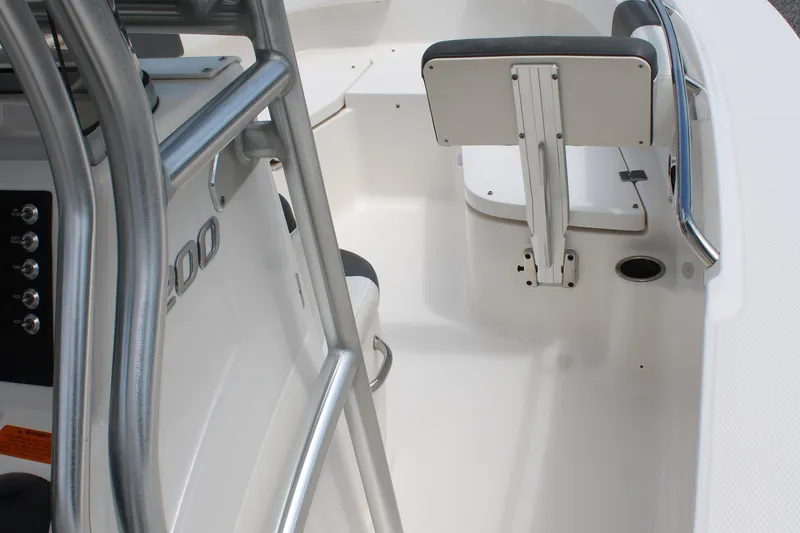 Slide: The Image of 2018 Robalo R200 Center Console boat interior with seating and control panel. - 26