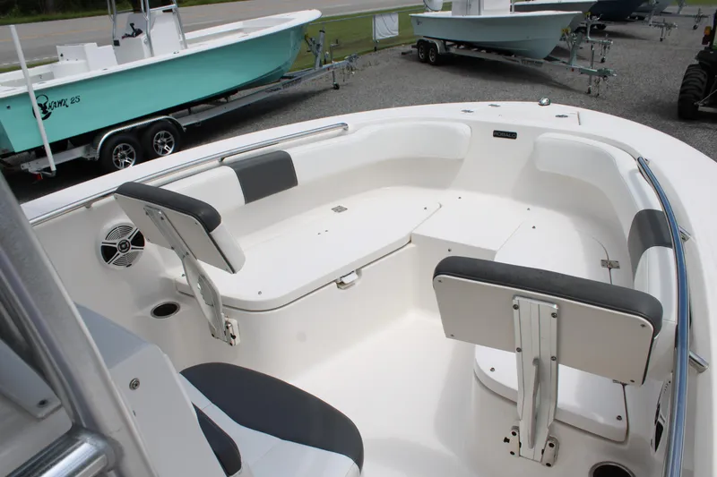 Slide: The Image of 2018 Robalo R200 Center Console boat interior with seating and storage. - 27