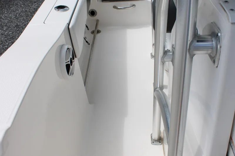 Slide: The Image of 2018 Robalo R200 Center Console boat interior with stainless steel railing and speaker. - 29