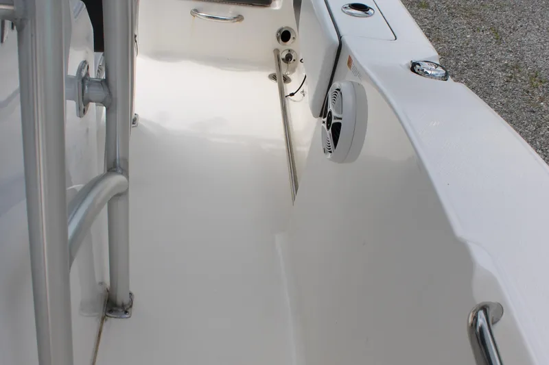 Slide: The Image of 2018 Robalo R200 Center Console boat interior with speaker and railing. - 30