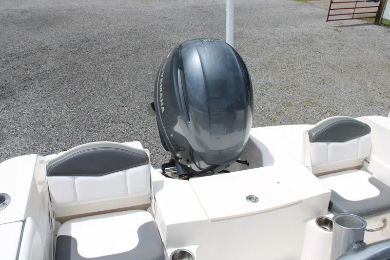 Slide: The Image of 2018 Robalo R200 Center Console boat with Yamaha outboard motor, featuring cushioned seating. - 34