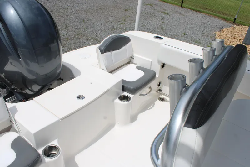 Slide: The Image of 2018 Robalo R200 Center Console boat interior with seating and rod holders. - 35