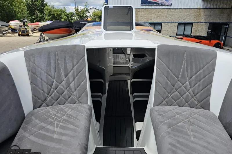 Slide: The Image of 2008 Nordic Powerboats 35 Flame MCOB interior with gray quilted seating and sleek design. - 104