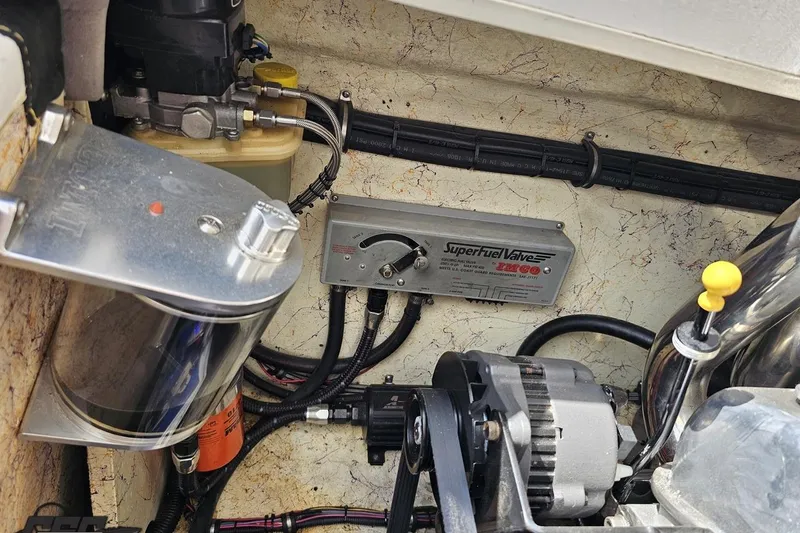 Slide: The Image of Engine compartment of a 2008 Nordic Powerboats 35 Flame MCOB, featuring a Superfuel Valve system. - 124