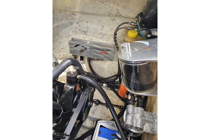 Slide: The Image of Engine compartment of 2008 Nordic Powerboats 35 Flame MCOB with fuel system components. - 127