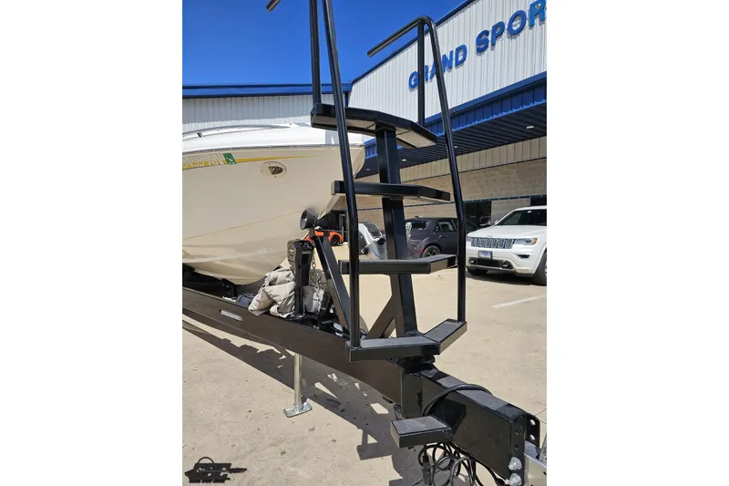 Slide: The Image of 2008 Nordic Powerboats 35 Flame MCOB on trailer with custom stairs, parked outside dealership. - 17