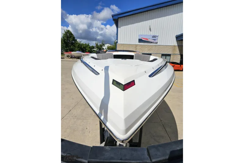 Slide: The Image of 2008 Nordic Powerboats 35 Flame MCOB, white hull, parked outdoors under blue sky. - 18