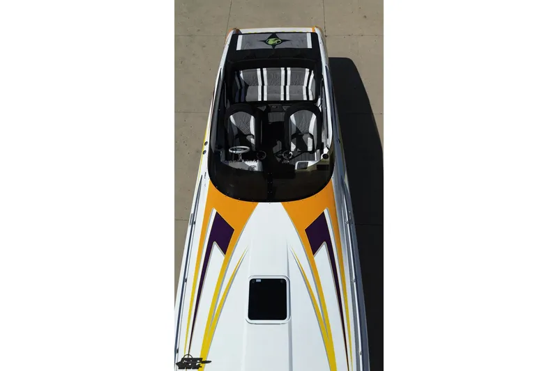 Slide: The Image of Top view of 2008 Nordic Powerboats 35 Flame MCOB with vibrant yellow and purple design. - 22