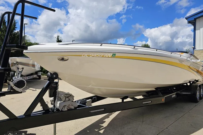 Slide: The Image of 2008 Nordic Powerboats 35 Flame MCOB on trailer under a partly cloudy sky. - 23